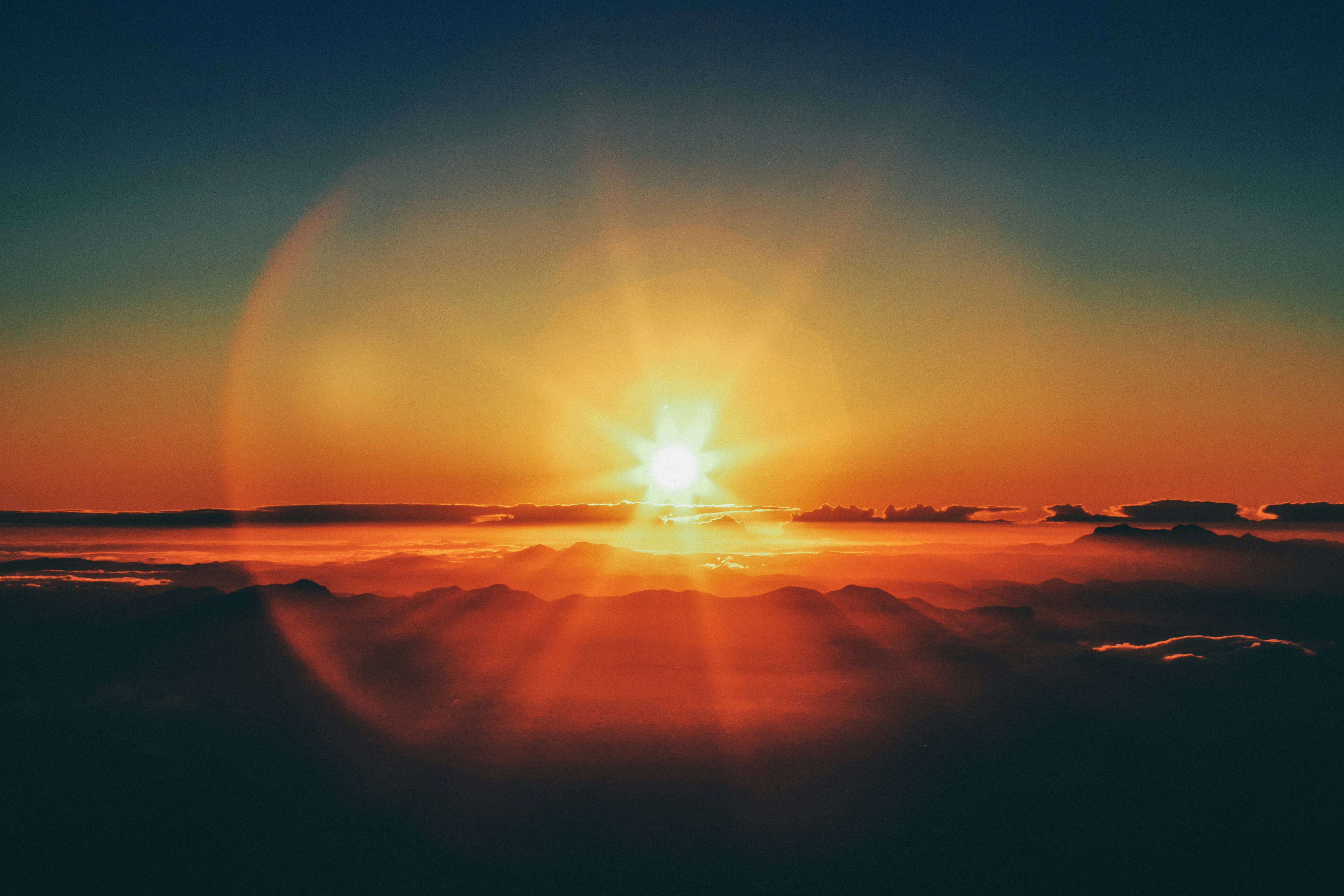 Sun rising over misty mountains